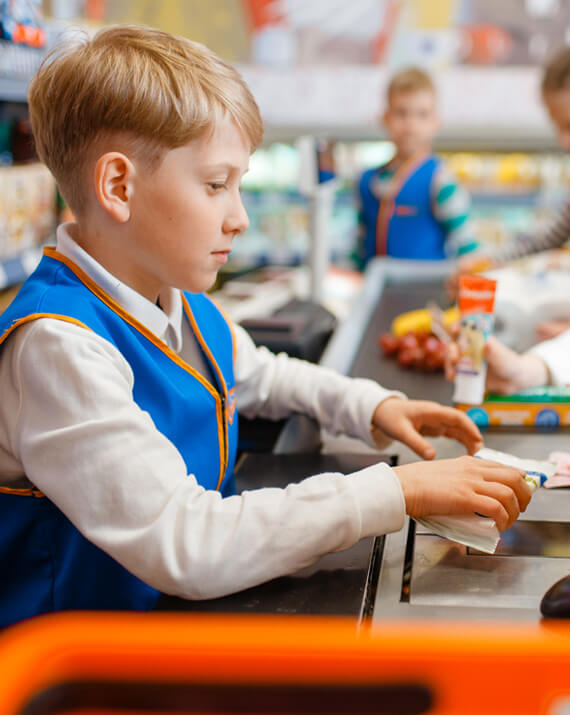 boy-in-uniform-at-the-register-playing-salesman-YXW57GU.jpg